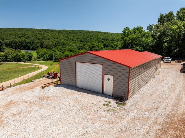 16175 N Cove Creek Wc 21 Rd, Prairie Grove, AR 72753 - detached garage featuring a forest view and driveway