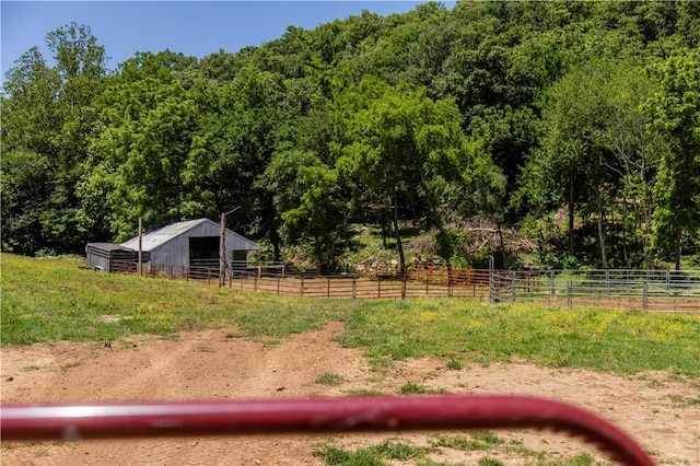 16175 N Cove Creek Wc 21 Rd, Prairie Grove, AR 72753 - view of yard featuring an exterior structure, an outdoor structure, a forest view, and a view of countryside