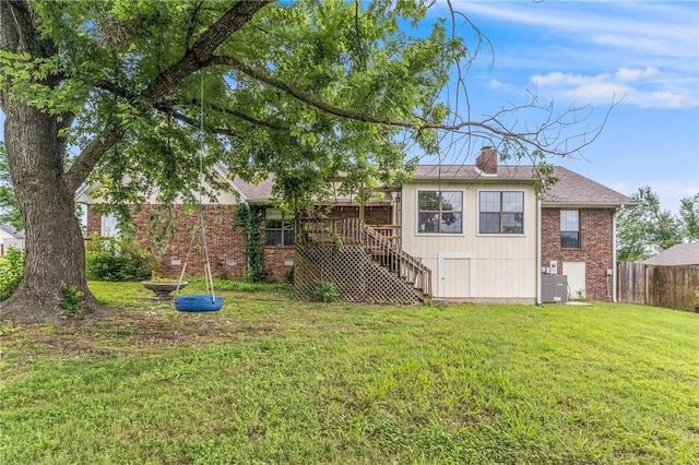 1206 Tru Ln, Rogers, AR 72756 - back of house featuring brick siding, stairway, a chimney, and a deck