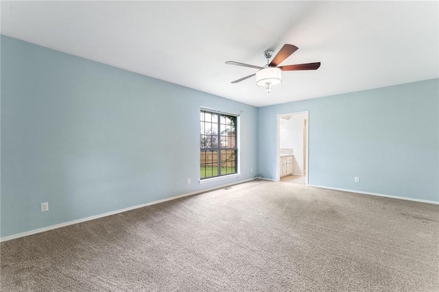 1206 Tru Ln, Rogers, AR 72756 - carpeted spare room featuring ceiling fan and baseboards