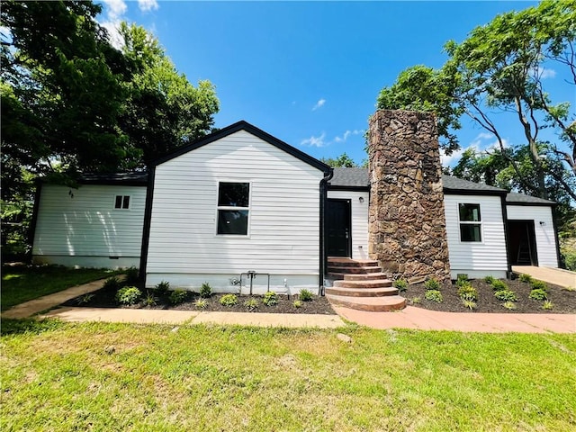 106 Phillips Ave, Huntsville, AR 72740 - view of front facade with a front lawn and a chimney