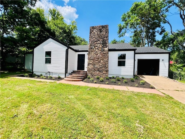 106 Phillips Ave, Huntsville, AR 72740 - view of front facade featuring a garage, driveway, a front lawn, and roof with shingles