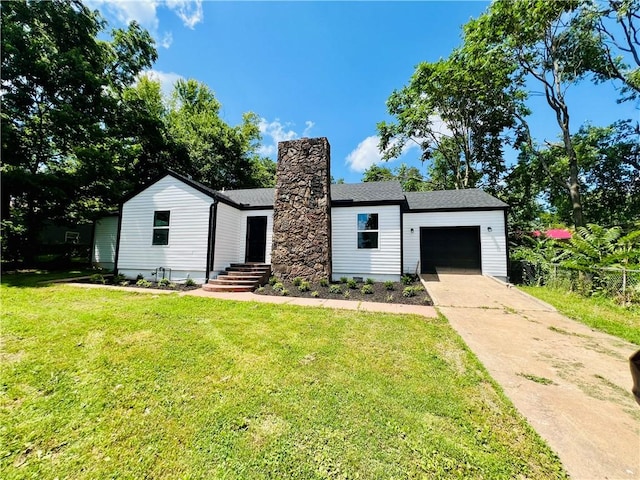 106 Phillips Ave, Huntsville, AR 72740 - view of front of home with a garage, concrete driveway, a front yard, and a chimney
