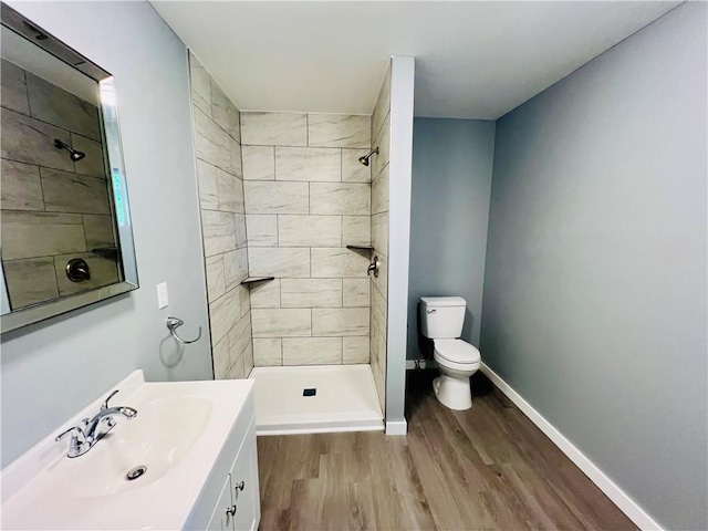 106 Phillips Ave, Huntsville, AR 72740 - bathroom featuring wood finished floors, vanity, and tiled shower