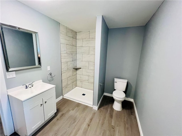 106 Phillips Ave, Huntsville, AR 72740 - full bathroom featuring wood finished floors, vanity, and a tile shower