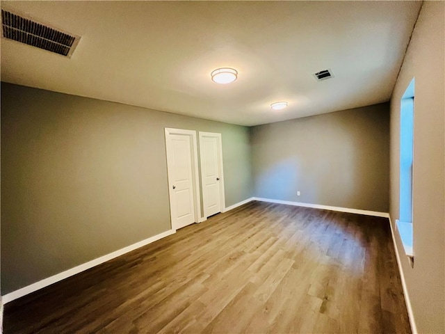 106 Phillips Ave, Huntsville, AR 72740 - empty room with wood finished floors and baseboards