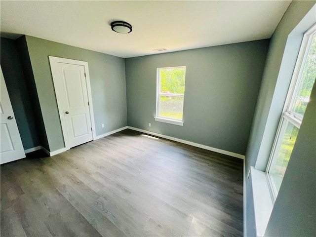 106 Phillips Ave, Huntsville, AR 72740 - unfurnished bedroom with wood finished floors and baseboards