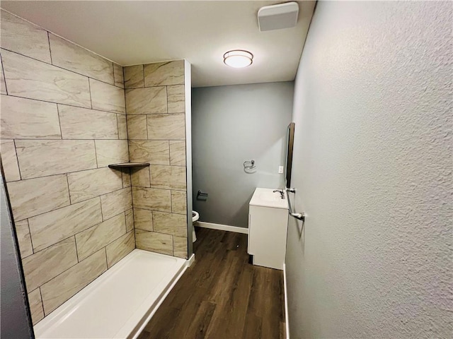 106 Phillips Ave, Huntsville, AR 72740 - bathroom with vanity, wood finished floors, and tiled shower