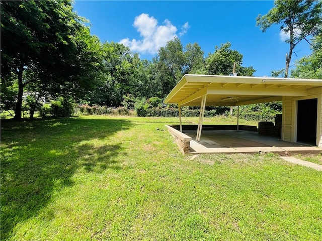 106 Phillips Ave, Huntsville, AR 72740 - view of vehicle parking featuring a carport