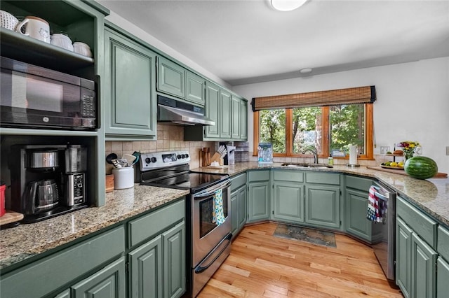 16048 Cypress Ln, Rogers, AR 72756 - kitchen featuring green cabinets, stainless steel appliances, under cabinet range hood, and light stone counters