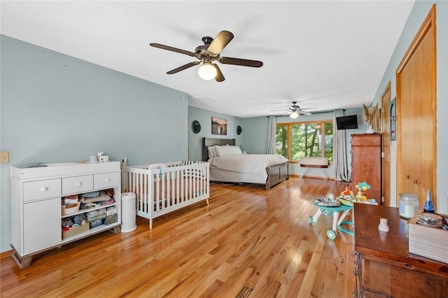 16048 Cypress Ln, Rogers, AR 72756 - bedroom featuring light wood-style flooring and a ceiling fan