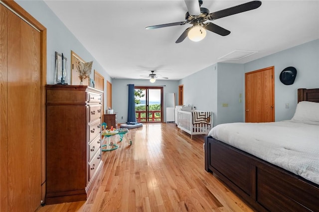 16048 Cypress Ln, Rogers, AR 72756 - bedroom featuring access to exterior, light wood-style flooring, attic access, and ceiling fan