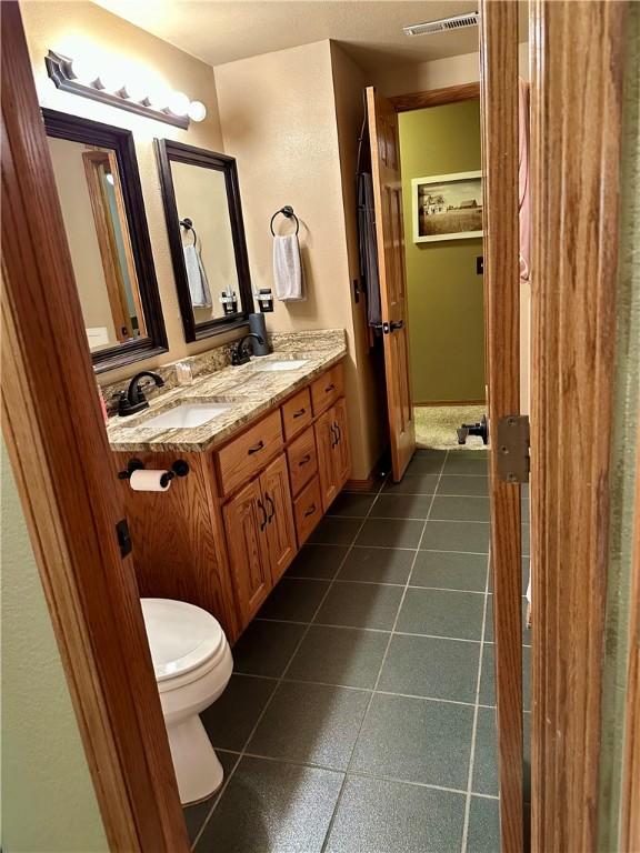 9364 Everest Pl, Rogers, AR 72756 - bathroom featuring tile patterned flooring and double vanity