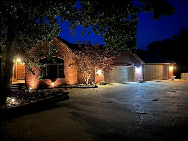 9364 Everest Pl, Rogers, AR 72756 - view of front of home featuring concrete driveway, brick siding, and a garage