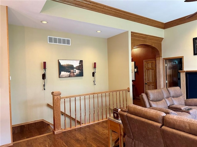 9364 Everest Pl, Rogers, AR 72756 - living area with wood finished floors, arched walkways, crown molding, and recessed lighting