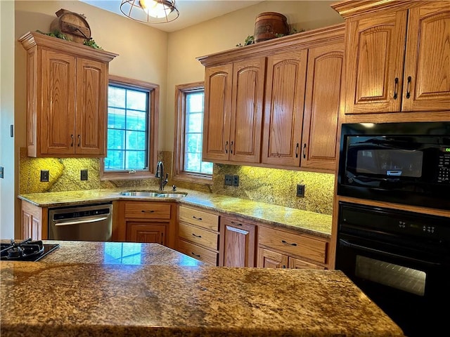 9364 Everest Pl, Rogers, AR 72756 - kitchen featuring black appliances, decorative backsplash, dark stone countertops, and brown cabinetry