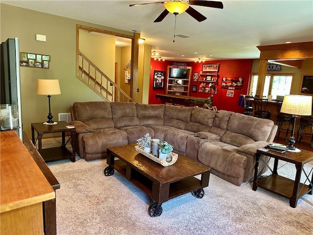 9364 Everest Pl, Rogers, AR 72756 - living area with light carpet, ceiling fan, and stairs