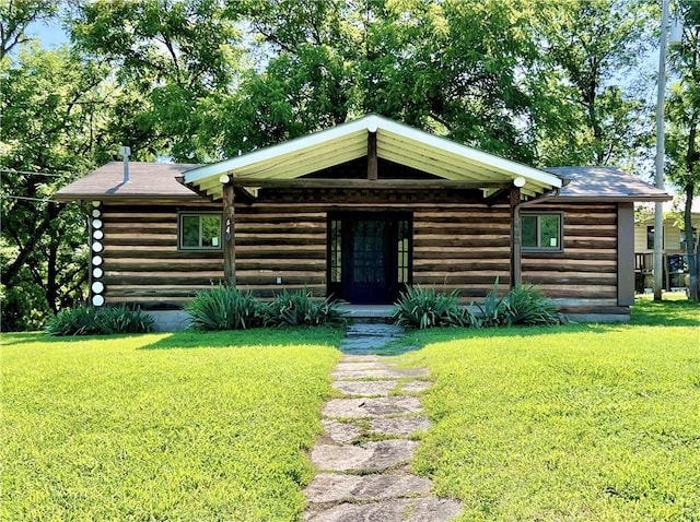 440 N Duff Ave, Sulphur Springs, AR 72768 - log-style house featuring a front lawn and log exterior
