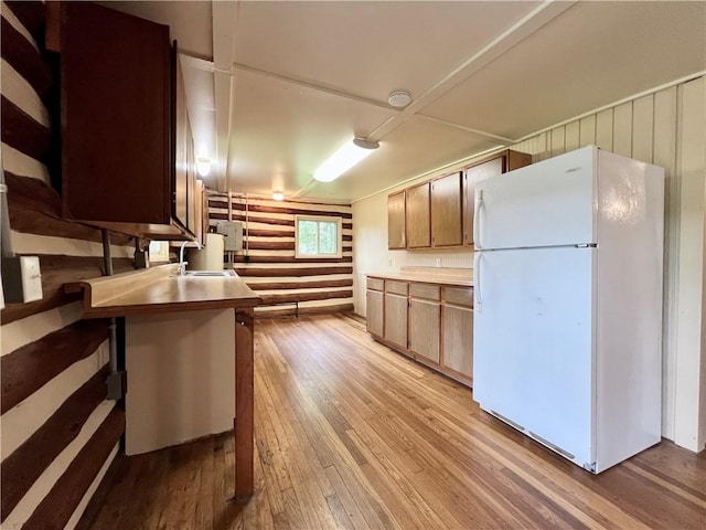 440 N Duff Ave, Sulphur Springs, AR 72768 - kitchen featuring freestanding refrigerator, light wood-style floors, and light countertops