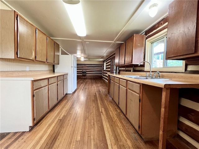 440 N Duff Ave, Sulphur Springs, AR 72768 - kitchen with freestanding refrigerator, light wood-type flooring, and light countertops