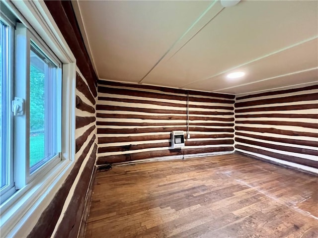 440 N Duff Ave, Sulphur Springs, AR 72768 - empty room with wooden walls, heating unit, and wood finished floors