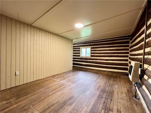 440 N Duff Ave, Sulphur Springs, AR 72768 - unfurnished room featuring wood-type flooring, wood walls, and heating unit