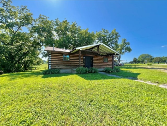 440 N Duff Ave, Sulphur Springs, AR 72768 - view of front of house with a front lawn and log siding