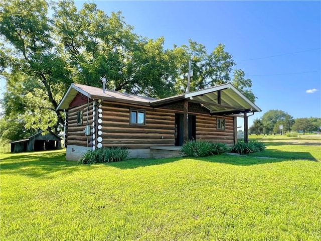 440 N Duff Ave, Sulphur Springs, AR 72768 - log home featuring a front lawn and log siding