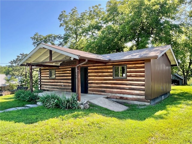 440 N Duff Ave, Sulphur Springs, AR 72768 - view of front facade with a front yard and log exterior