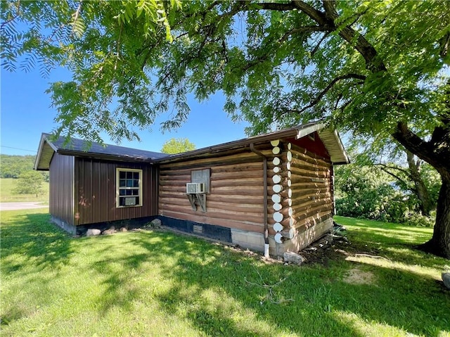 440 N Duff Ave, Sulphur Springs, AR 72768 - view of home's exterior featuring log exterior, a lawn, and cooling unit