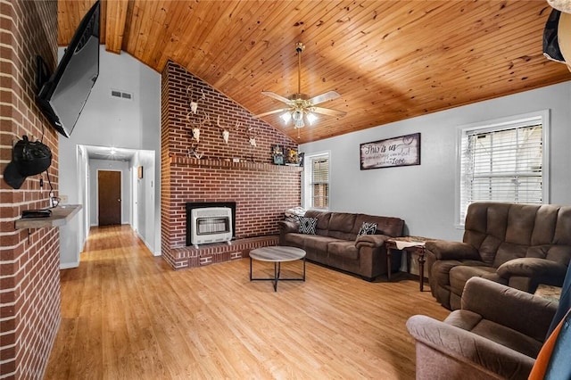 63155 S 4700, Watts, OK 74964 - living room with a fireplace, healthy amount of natural light, wood finished floors, a ceiling fan, and wooden ceiling