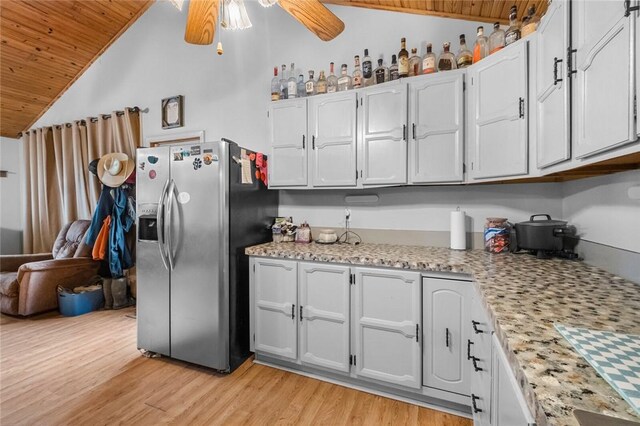 63155 S 4700, Watts, OK 74964 - kitchen with stainless steel refrigerator with ice dispenser, wood ceiling, vaulted ceiling, ceiling fan, and light wood-style flooring