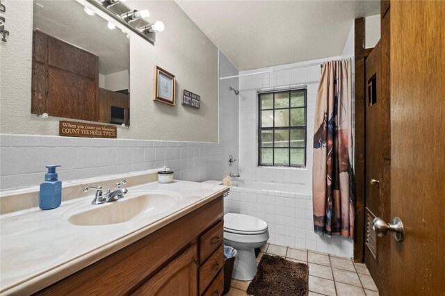 63155 S 4700, Watts, OK 74964 - bathroom featuring tile patterned floors, tiled shower / bath combo, vanity, and tile walls