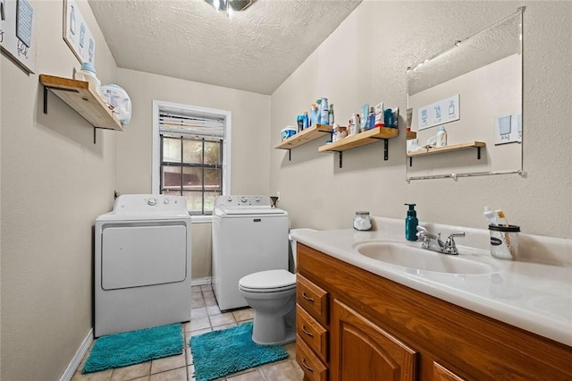 63155 S 4700, Watts, OK 74964 - bathroom featuring washer and clothes dryer, a textured ceiling, vanity, and tile patterned floors