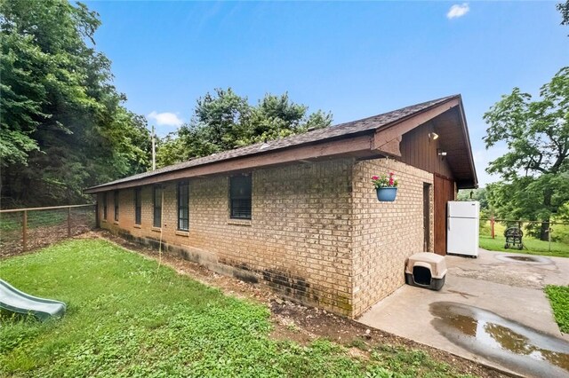 63155 S 4700, Watts, OK 74964 - view of side of property featuring brick siding, a patio area, and crawl space