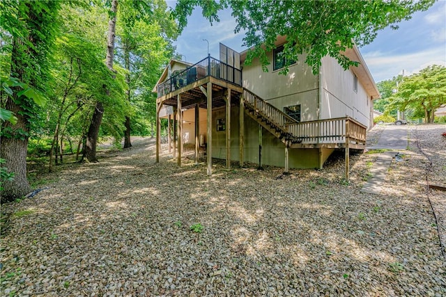 2 Kildonan Ln, Bella Vista, AR 72715 - rear view of property featuring a deck and stairway