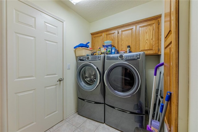 2 Kildonan Ln, Bella Vista, AR 72715 - laundry room with cabinet space, independent washer and dryer, light tile patterned floors, and a textured ceiling