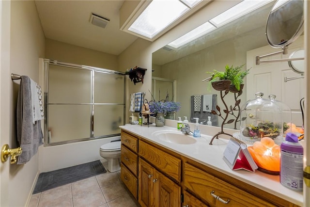 2 Kildonan Ln, Bella Vista, AR 72715 - bathroom with tile patterned flooring, vanity, bath / shower combo with glass door, and a skylight
