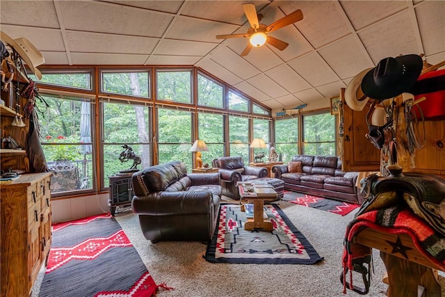 2 Kildonan Ln, Bella Vista, AR 72715 - carpeted living area featuring vaulted ceiling, plenty of natural light, and a ceiling fan