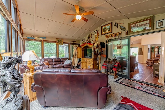 2 Kildonan Ln, Bella Vista, AR 72715 - carpeted living area with a ceiling fan and lofted ceiling