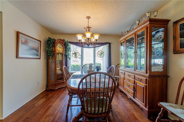 2 Kildonan Ln, Bella Vista, AR 72715 - dining room with a chandelier, dark wood-style flooring, and a textured ceiling