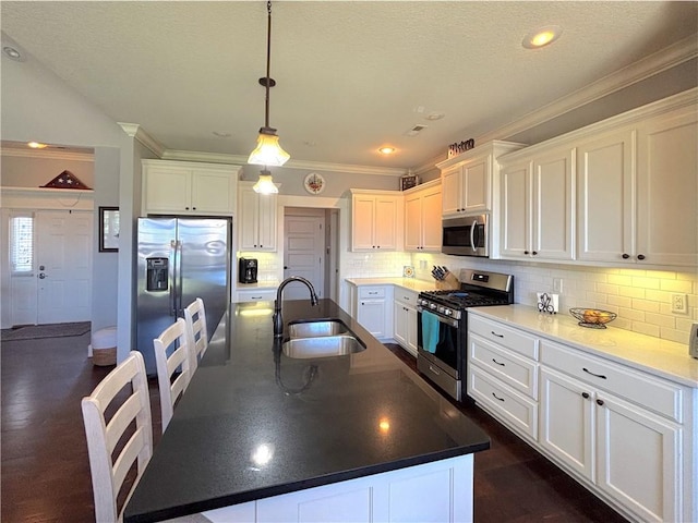 1610 Sweetbriar, Centerton, AR 72719 - kitchen featuring stainless steel appliances, ornamental molding, white cabinetry, a spacious island, and pendant lighting