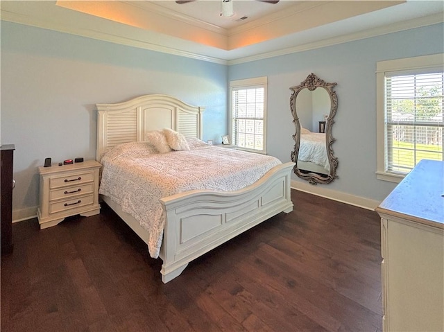1610 Sweetbriar, Centerton, AR 72719 - bedroom featuring a tray ceiling, multiple windows, crown molding, dark wood-type flooring, and a ceiling fan
