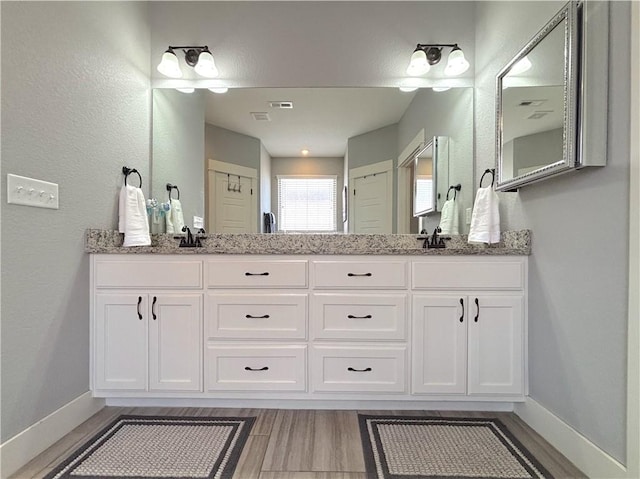 1610 Sweetbriar, Centerton, AR 72719 - bathroom with double vanity and wood finished floors