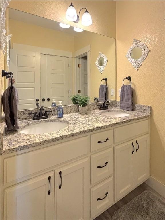 1610 Sweetbriar, Centerton, AR 72719 - full bathroom with double vanity and a textured wall
