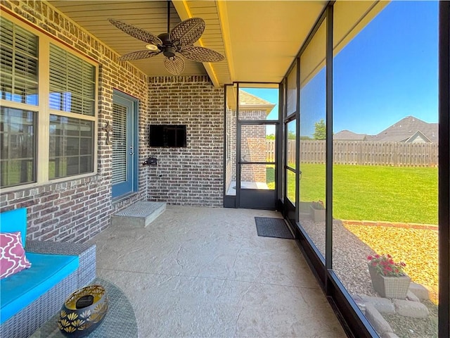 1610 Sweetbriar, Centerton, AR 72719 - unfurnished sunroom featuring ceiling fan