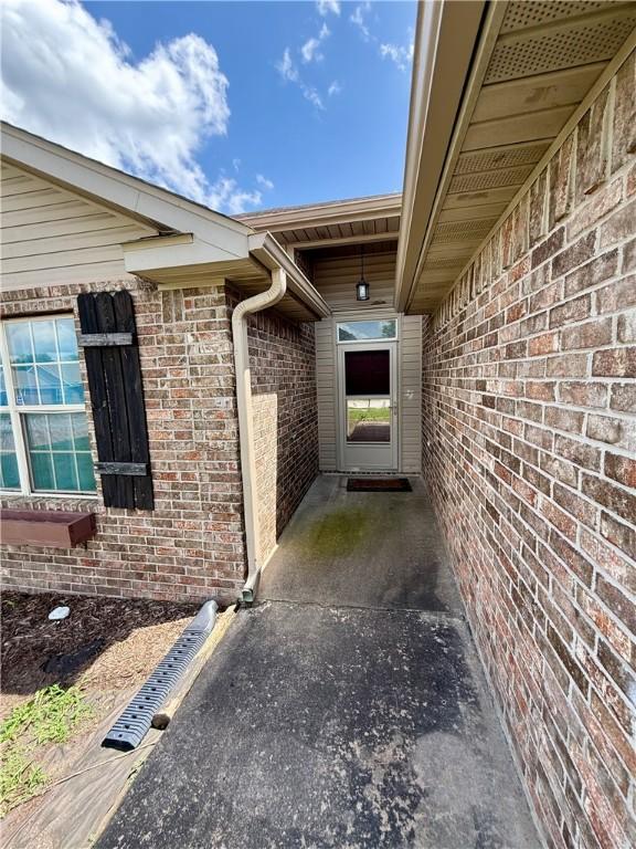 1204 Jim Mcvay, Siloam Springs, AR 72761 - view of exterior entry with brick siding