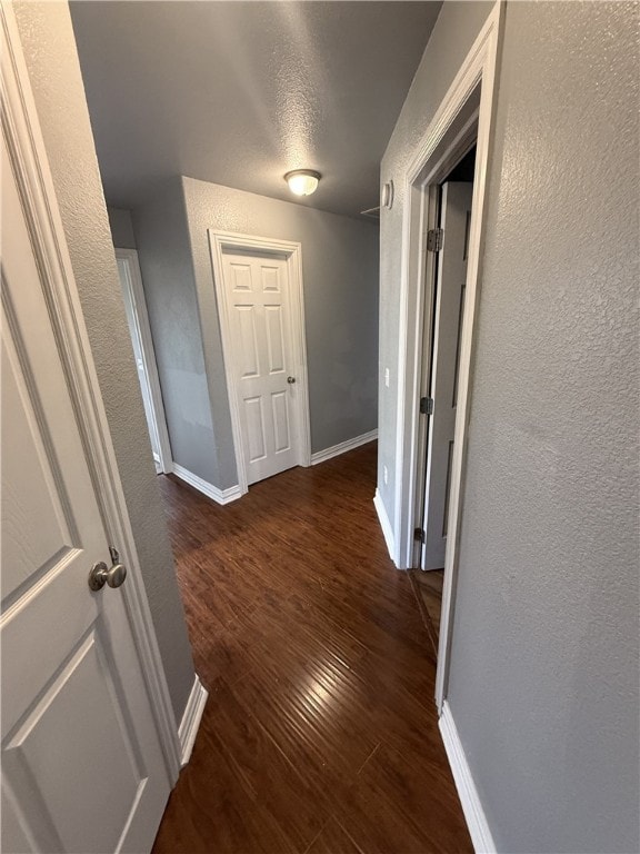 1204 Jim Mcvay, Siloam Springs, AR 72761 - hallway featuring a textured wall, wood finished floors, and a textured ceiling