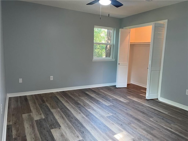 904 E Norristown Cir, Russellville, AR 72802 - unfurnished bedroom with dark wood finished floors, a closet, and a ceiling fan