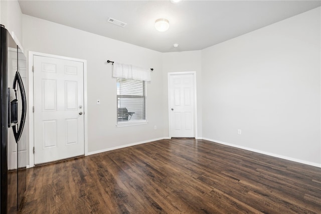 927 E Swift Dr, Fayetteville, AR 72701 - washroom with dark wood-style flooring and baseboards